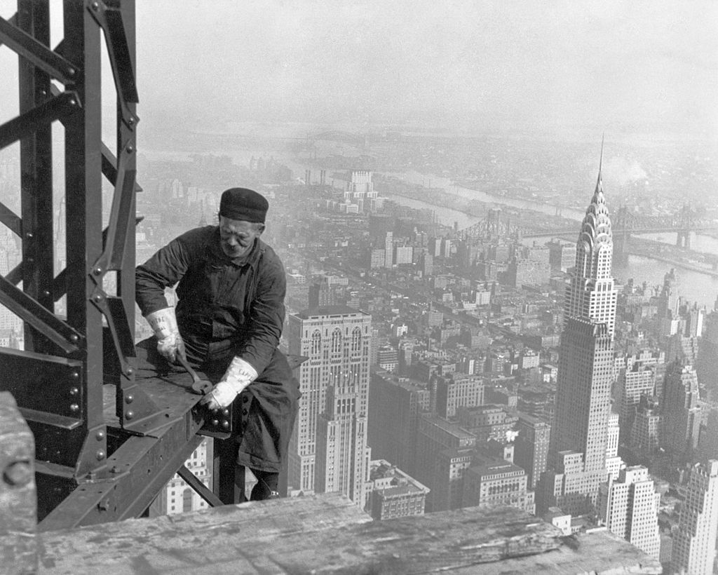 A worker bolts beams during construction of Empire State Building